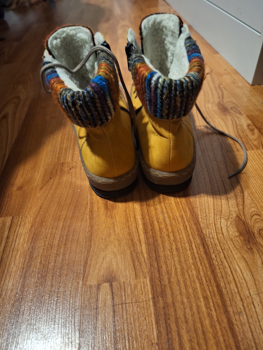 yellow Rieker Felicitas ankle boots feature a unique colorful knitted coll